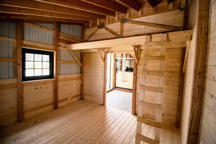Finished 12×12 tack room with hay loft and ladder